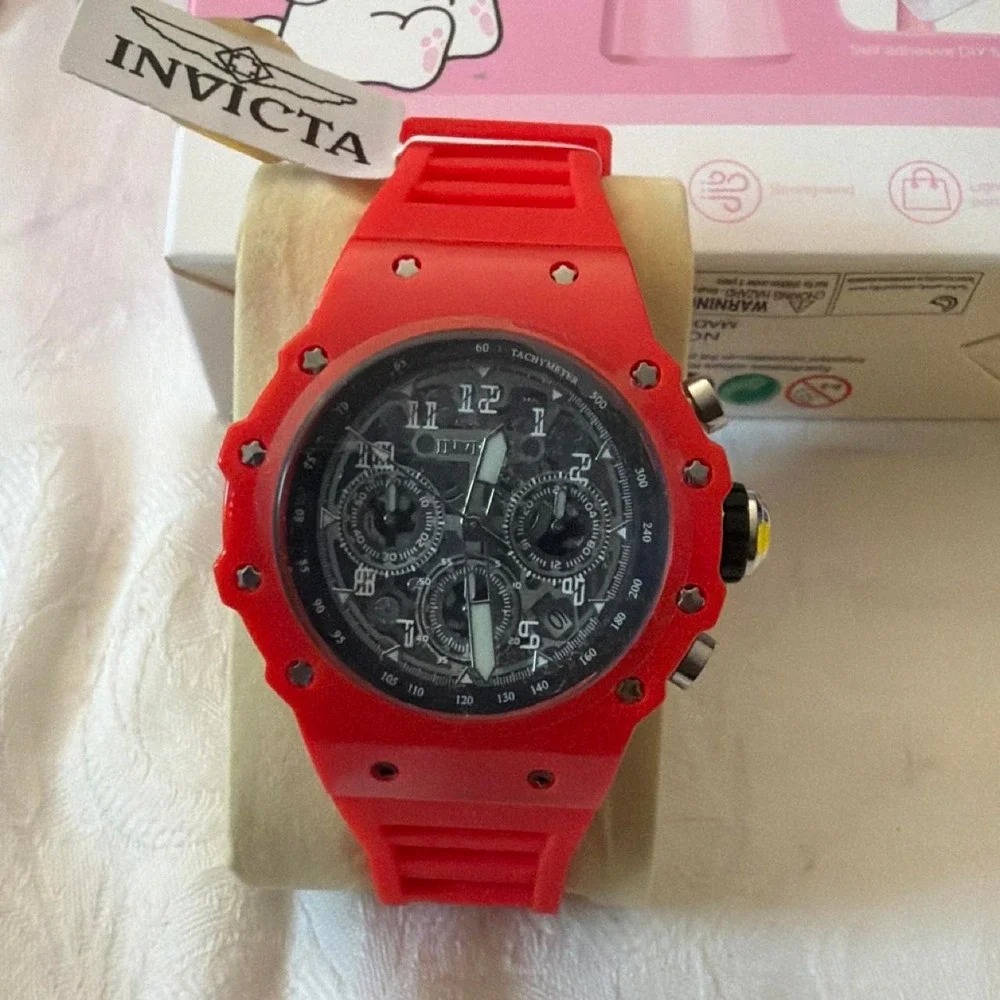 Invicta blue watch with white stripes on the band Blue, Red, yellow, Green